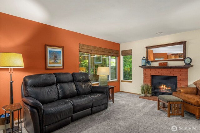 2041 NW Tregaten Ln, Poulsbo, WA 98370 - carpeted living area with a fireplace and baseboards
