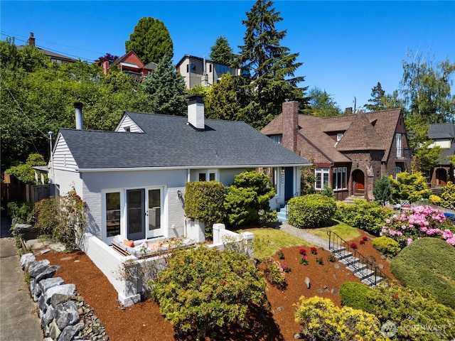 3249 Conkling Pl W, Seattle, WA 98119 - back of property with a chimney, roof with shingles, and brick siding