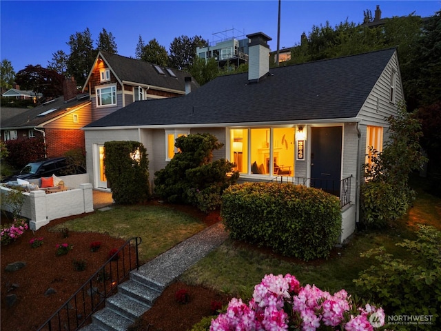 3249 Conkling Pl W, Seattle, WA 98119 - view of front of home featuring brick siding, a chimney, a front yard, and a shingled roof