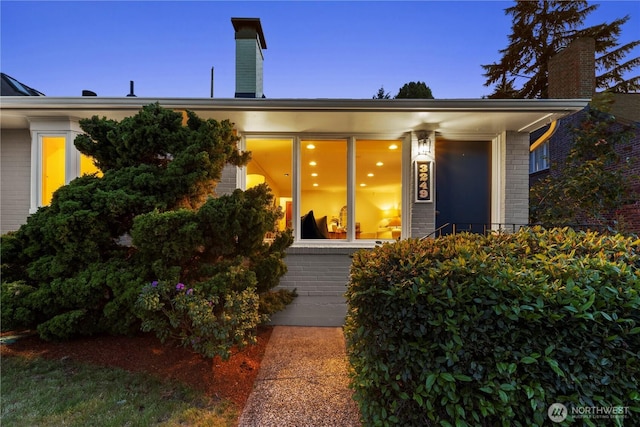 3249 Conkling Pl W, Seattle, WA 98119 - property entrance with brick siding and a chimney
