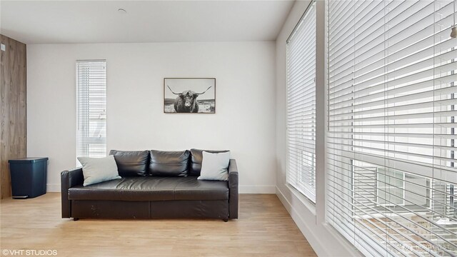 444 13th Ave, Seattle, WA 98122 - living area with plenty of natural light, light wood finished floors, and baseboards