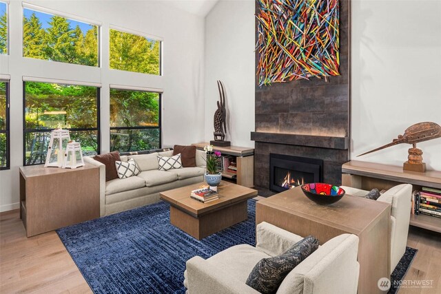 12 Columbia Ky, Bellevue, WA 98006 - living area with a fireplace, wood finished floors, and a towering ceiling