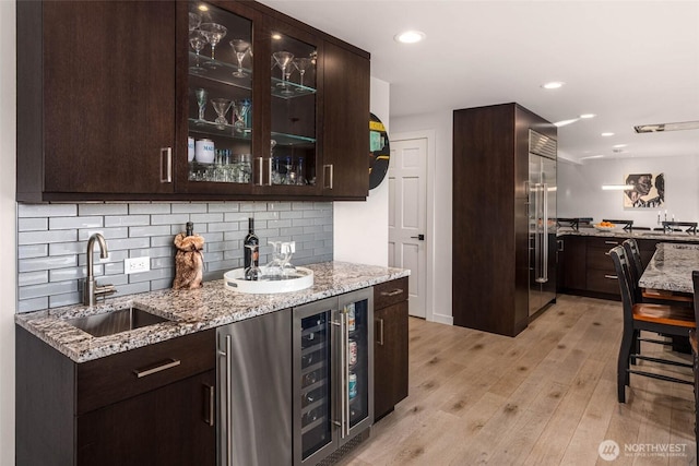 12 Columbia Ky, Bellevue, WA 98006 - indoor wet bar with high quality fridge, wine cooler, light wood finished floors, decorative backsplash, and recessed lighting