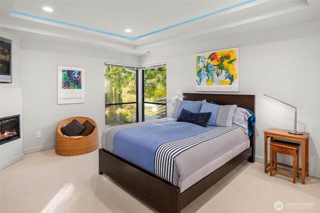 12 Columbia Ky, Bellevue, WA 98006 - carpeted bedroom with a tray ceiling, recessed lighting, baseboards, and a glass covered fireplace
