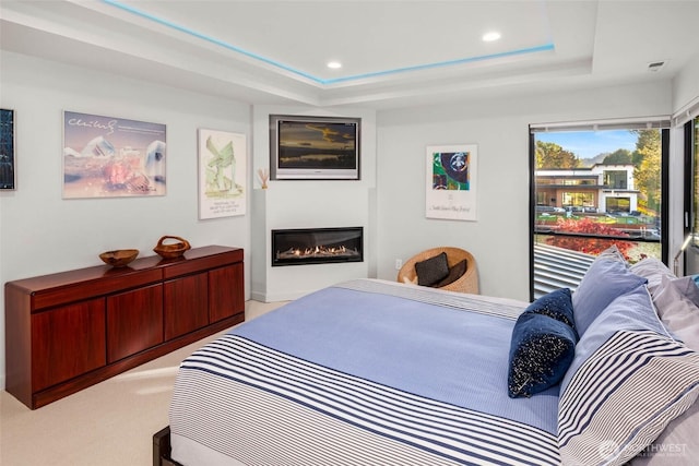 12 Columbia Ky, Bellevue, WA 98006 - carpeted bedroom with a tray ceiling, a glass covered fireplace, and recessed lighting