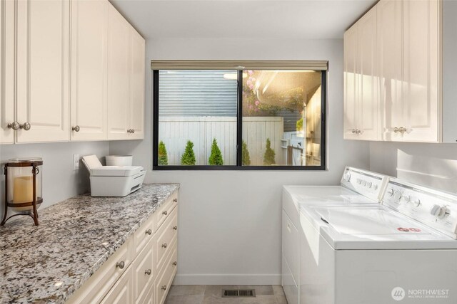 12 Columbia Ky, Bellevue, WA 98006 - laundry area featuring cabinet space, washer and dryer, and baseboards