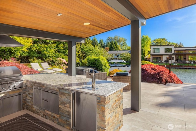 12 Columbia Ky, Bellevue, WA 98006 - view of patio / terrace with a water view and an outdoor bar