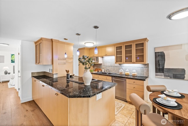 3834 175th Ave NE Unit 101, Redmond, WA 98052 - kitchen featuring appliances with stainless steel finishes, a peninsula, glass insert cabinets, tasteful backsplash, and light brown cabinets