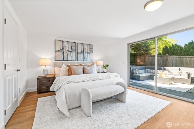 3834 175th Ave NE Unit 101, Redmond, WA 98052 - bedroom with access to exterior and light wood-type flooring