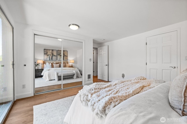 3834 175th Ave NE Unit 101, Redmond, WA 98052 - bedroom with wood finished floors and a closet