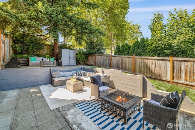 3834 175th Ave NE Unit 101, Redmond, WA 98052 - fenced backyard featuring an outdoor living space with a fire pit and a patio