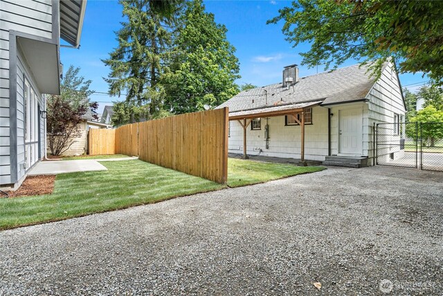2319 Washington St SE, Olympia, WA 98501 - exterior space featuring a gate, roof with shingles, and a chimney