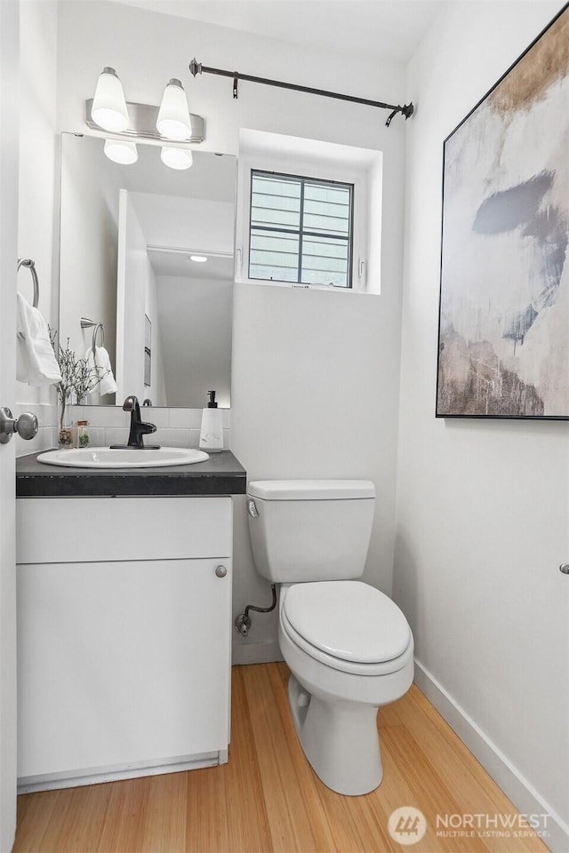 5028 Delridge Way SW Unit C, Seattle, WA 98106 - bathroom featuring wood finished floors and vanity