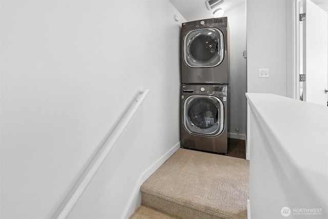 5028 Delridge Way SW Unit C, Seattle, WA 98106 - laundry area with estacked washer and dryer and carpet flooring