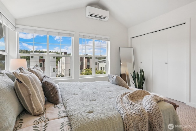 5028 Delridge Way SW Unit C, Seattle, WA 98106 - bedroom with a wall unit AC, vaulted ceiling, light carpet, and a closet