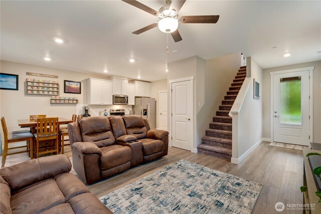 8323 E Gilman Ave, Arlington, WA 98223 - living area with stairway, a ceiling fan, light wood-style floors, baseboards, and recessed lighting