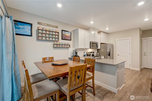 8323 E Gilman Ave, Arlington, WA 98223 - dining space with light wood-style flooring, recessed lighting, and baseboards