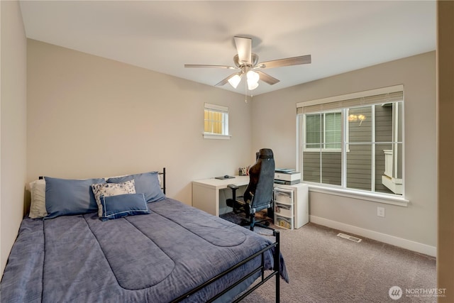 8323 E Gilman Ave, Arlington, WA 98223 - carpeted bedroom featuring baseboards, a desk, and a ceiling fan