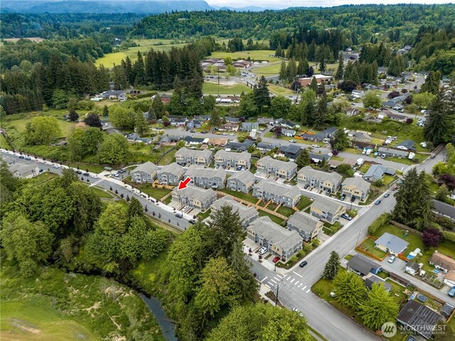 8323 E Gilman Ave, Arlington, WA 98223 - aerial overview of property's location featuring a forest