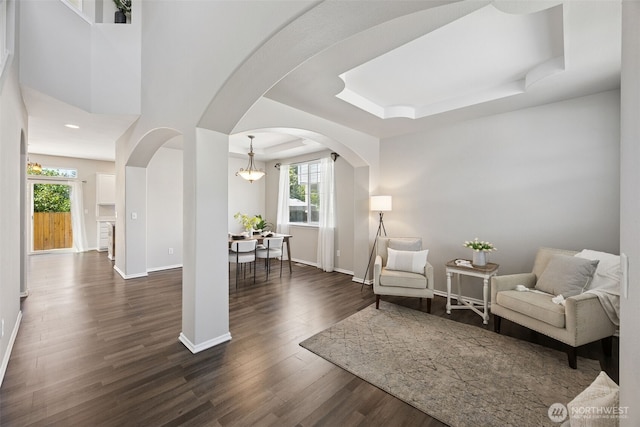 18216 80th Ave E, Puyallup, WA 98375 - living area featuring plenty of natural light, dark wood-type flooring, and baseboards