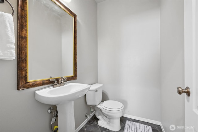 18216 80th Ave E, Puyallup, WA 98375 - half bathroom with toilet, tile patterned flooring, and baseboards