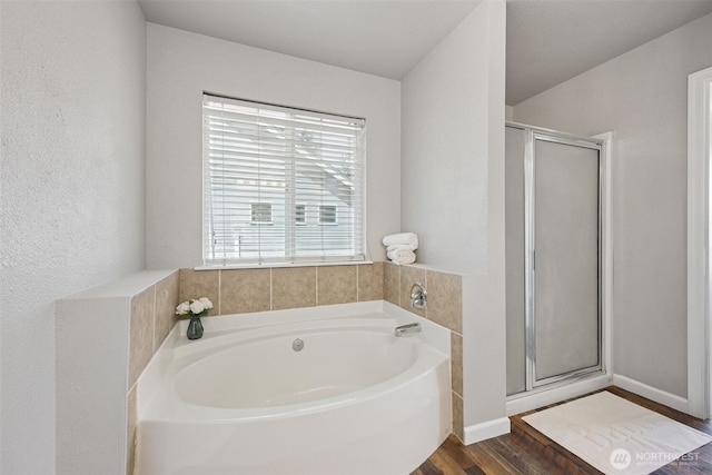 18216 80th Ave E, Puyallup, WA 98375 - bathroom with a stall shower, a bath, and wood finished floors