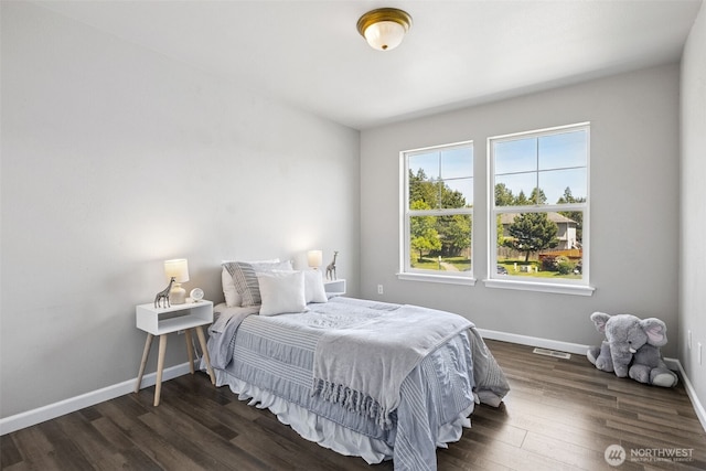18216 80th Ave E, Puyallup, WA 98375 - bedroom featuring baseboards and dark wood-type flooring