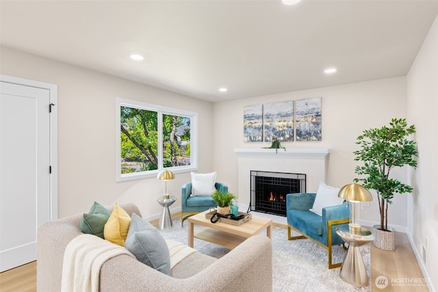 4022 N 19th St, Tacoma, WA 98406 - living room featuring light wood-style floors, a fireplace with flush hearth, recessed lighting, and baseboards
