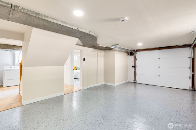 4022 N 19th St, Tacoma, WA 98406 - garage featuring washer / clothes dryer and baseboards