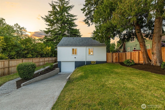 4022 N 19th St, Tacoma, WA 98406 - outdoor structure at dusk featuring a garage and concrete driveway