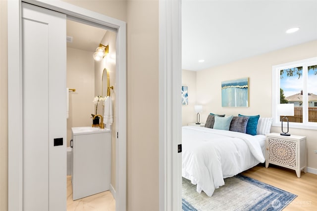 4022 N 19th St, Tacoma, WA 98406 - bedroom with baseboards, recessed lighting, light wood-style flooring, and a sink