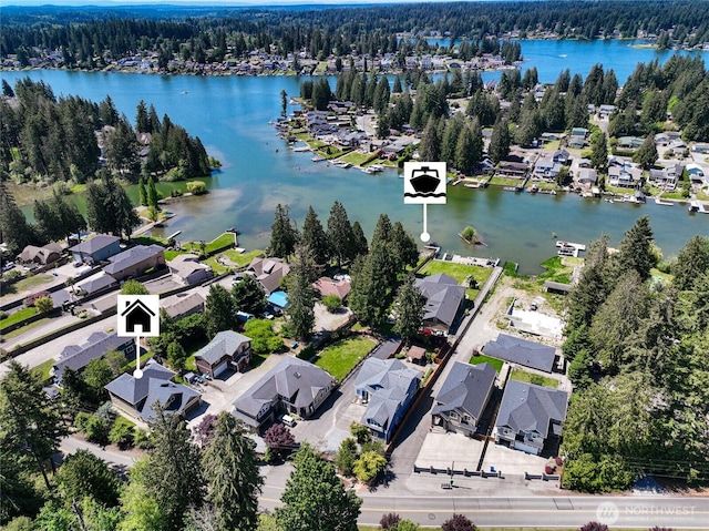 6214 207th Ave E, Bonney Lake, WA 98391 - aerial view of property and surrounding area featuring a heavily wooded area, nearby suburban area, and a nearby body of water