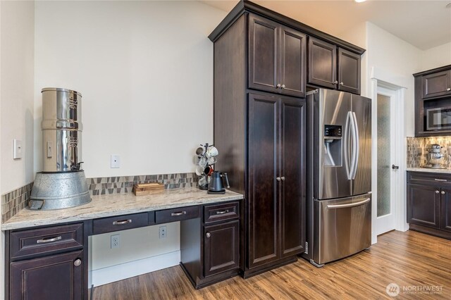 6214 207th Ave E, Bonney Lake, WA 98391 - kitchen featuring appliances with stainless steel finishes, tasteful backsplash, and dark brown cabinetry