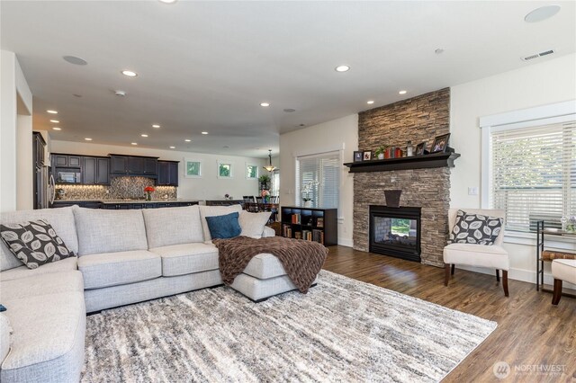 6214 207th Ave E, Bonney Lake, WA 98391 - living room featuring wood finished floors, recessed lighting, and a fireplace