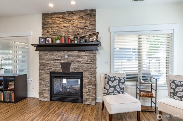 6214 207th Ave E, Bonney Lake, WA 98391 - living area with a stone fireplace, wood finished floors, healthy amount of natural light, and recessed lighting