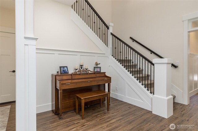 6214 207th Ave E, Bonney Lake, WA 98391 - stairs with a decorative wall, wood finished floors, and a wainscoted wall