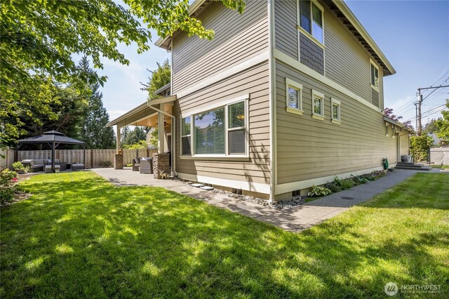 6214 207th Ave E, Bonney Lake, WA 98391 - view of property exterior featuring a gazebo, outdoor lounge area, and a patio area