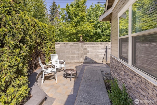 6214 207th Ave E, Bonney Lake, WA 98391 - view of patio featuring a fire pit