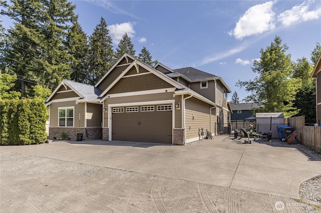 6214 207th Ave E, Bonney Lake, WA 98391 - craftsman-style house with concrete driveway, an attached garage, and stone siding
