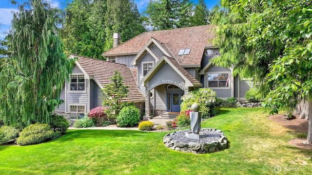 8795 Wood Duck Way, Blaine, WA 98230 - view of front facade with a chimney, a front yard, and stone siding