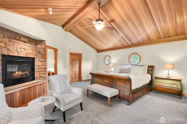 8795 Wood Duck Way, Blaine, WA 98230 - bedroom with carpet flooring, wooden ceiling, a stone fireplace, and a ceiling fan