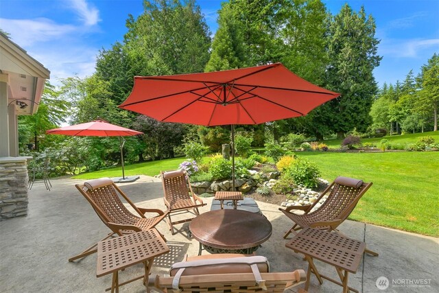 8795 Wood Duck Way, Blaine, WA 98230 - view of patio / terrace with an outdoor fire pit and view of scattered trees