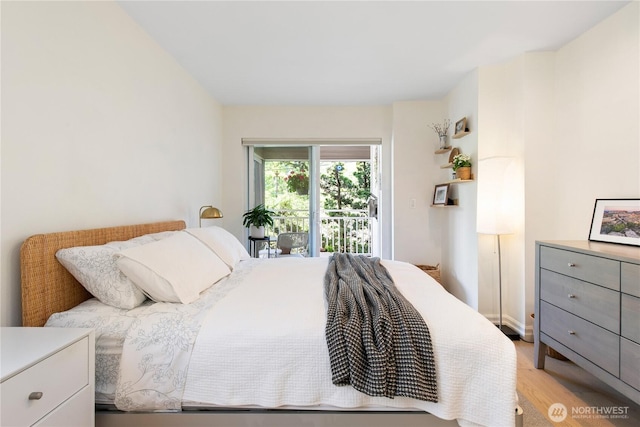 215 20th Ave E Unit 203, Seattle, WA 98112 - bedroom featuring light wood-type flooring and access to exterior