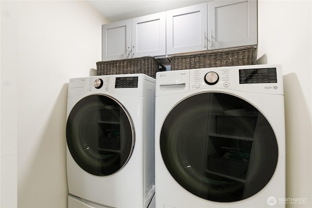 215 20th Ave E Unit 203, Seattle, WA 98112 - laundry area with cabinet space and washer and dryer