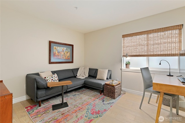 215 20th Ave E Unit 203, Seattle, WA 98112 - living room featuring wood finished floors, an office area, and baseboards