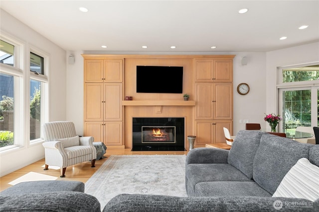 412 N 69th Ave, Yakima, WA 98908 - living room with light wood-type flooring, recessed lighting, and a fireplace