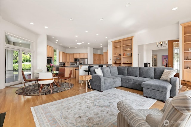 412 N 69th Ave, Yakima, WA 98908 - living area featuring a chandelier, recessed lighting, and light wood finished floors
