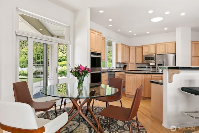 412 N 69th Ave, Yakima, WA 98908 - kitchen featuring stainless steel appliances, light brown cabinetry, plenty of natural light, tasteful backsplash, and recessed lighting