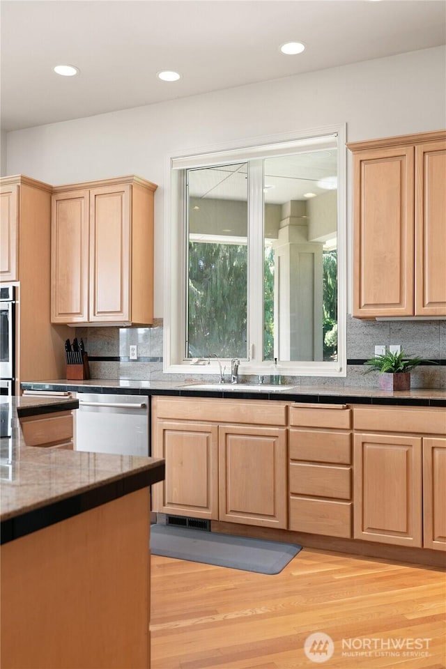 412 N 69th Ave, Yakima, WA 98908 - kitchen with light brown cabinetry, stainless steel appliances, a sink, tasteful backsplash, and recessed lighting