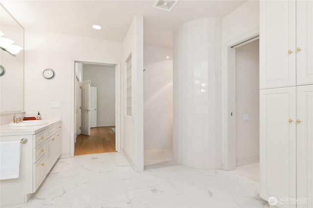 412 N 69th Ave, Yakima, WA 98908 - bathroom with marble look tiles, vanity, and walk in shower